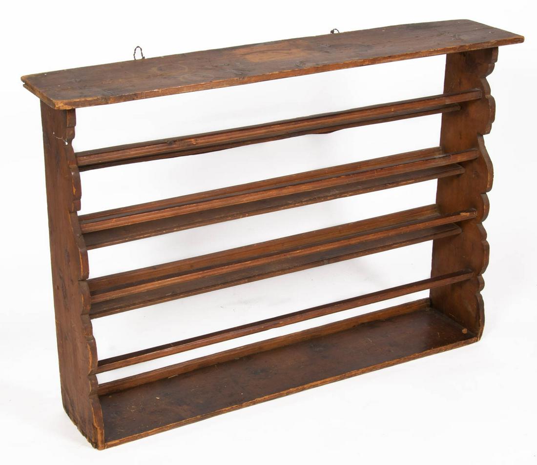 COUNTRY PINE HANGING DISH RACK: COUNTRY PINE HANGING DISH RACK, nailed construction, with shaped sides and four shelves. Original dry natural surface. 19th century. 33 3/4" H, 47 3/4" W, 9" D. Provenance: Property from the estate of