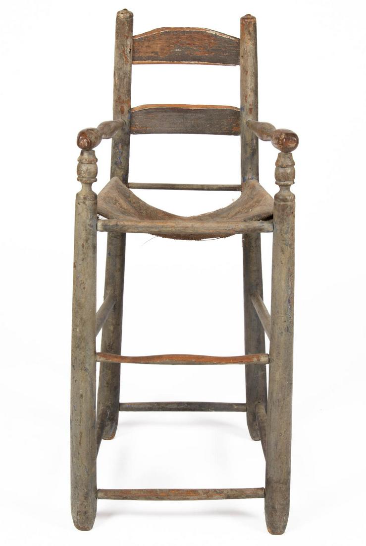 AMERICAN TURNED OAK HIGH CHAIR WITH CARPET SEAT: AMERICAN TURNED OAK HIGH CHAIR WITH CARPET SEAT, two-slat back, turned arms, splayed legs joined with double-box stretcher. Retains an old oyster white-painted surface. Late 18th/early 19th century. 3