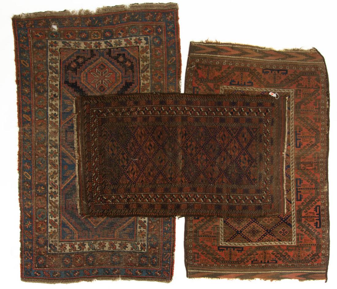 ANTIQUE PERSIAN AFGHAN / PERSIAN THROW RUGS, LOT OF: ANTIQUE PERSIAN AFGHAN / PERSIAN THROW RUGS, LOT OF THREE, including one with three medallions. Late 19th/early 20th century. One 5' 1 3/4" x 2' 11".Provenance: From the estate of David Proctor, Staun