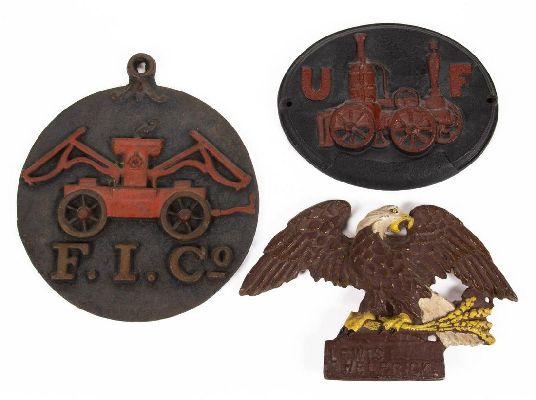ASSORTED CAST-IRON FIRE INSURANCE MARKS / PLAQUES, LOT: ASSORTED CAST-IRON FIRE INSURANCE MARKS / PLAQUES, LOT OF THREE, comprising a Firemenâ€™s Insurance Company example, depicting a fire engine painted red over "F. I. Co"; an oval-form United Firem