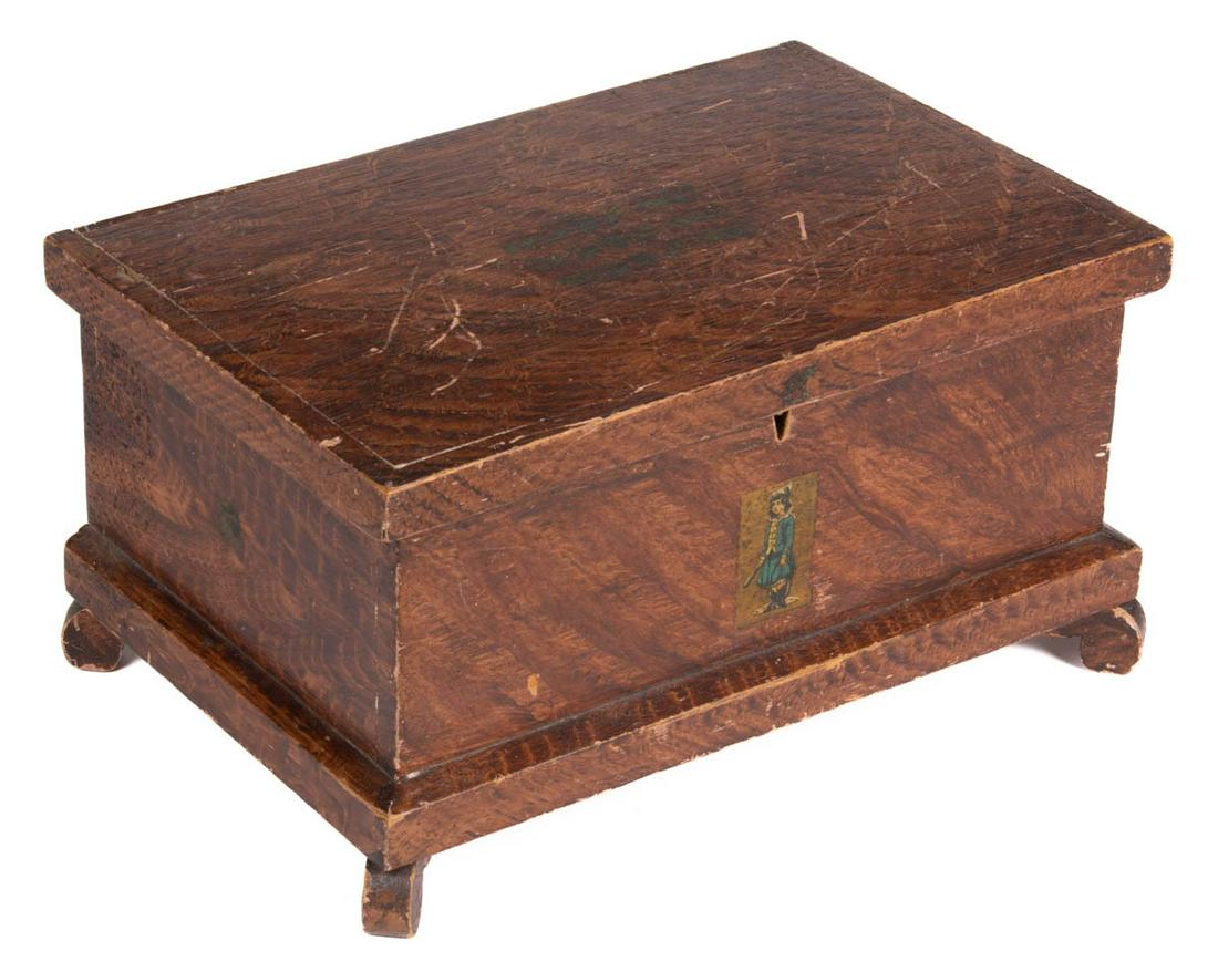 PENNSYLVANIA PAINT-DECORATED PINE MINIATURE BLANKET: PENNSYLVANIA PAINT-DECORATED PINE MINIATURE BLANKET CHEST, hinged lid with applied edge moldings, nailed case with applied base moldings, raised on four scrolled feet. Original brass lock and key. Ret