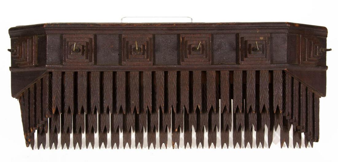 AMERICAN FOLK / TRAMP ART WALL BOX / SHELF: AMERICAN FOLK / TRAMP ART WALL BOX / SHELF, featuring stepped decoration with six original hanging hooks. Retains original surface with rich color. Late 19th/early 20th century. 7 1/2" H, 20" W. Prove