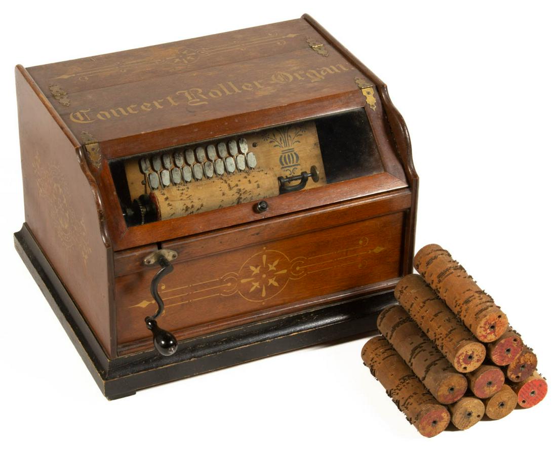 CONCERT ROLLER ORGAN MUSIC BOX WITH CYLINDERS: CONCERT ROLLER ORGAN MUSIC BOX WITH CYLINDERS, uncounted lot, stenciled "Concert Roller Organ". Retains likely original surface with warm color. Fourth quarter 19th century. 12 1/2" H.