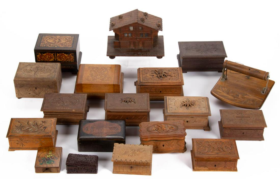 ASSORTED CONTINENTAL WOODEN ARTICLES, LOT OF 18: ASSORTED CONTINENTAL WOODEN ARTICLES, LOT OF 18, including Swiss musical toilet paper dispenser, two music box examples with cigarette holders, and jewelry box examples including one with carved acorn