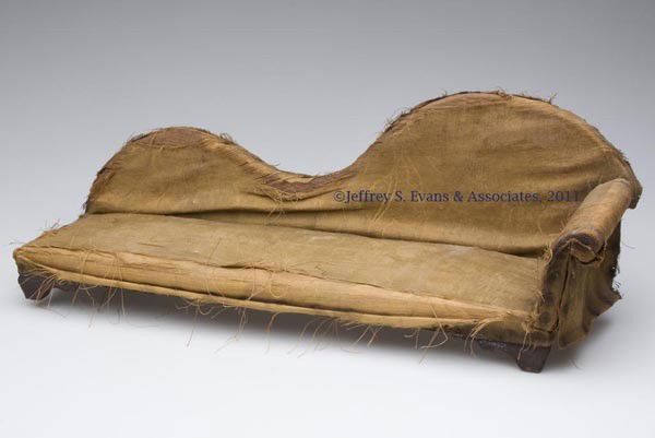 LATE EMPIRE DOLL FAINTING COUCH: LATE EMPIRE DOLL FAINTING COUCH, pine and poplar frame, square nail construction. Mid 19th century. 7 1/2" H, 21" L. Provenance: From a New York estate.