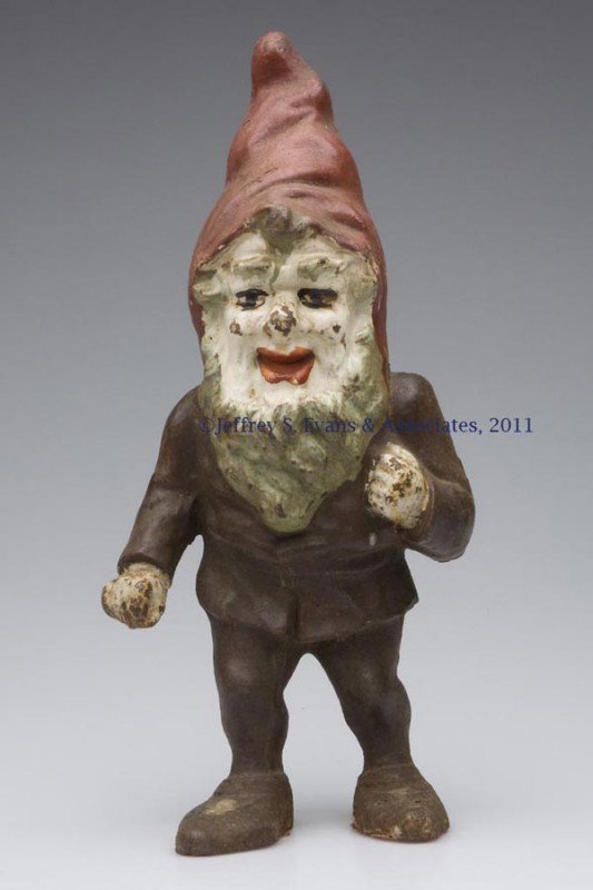 GNOME CAST-IRON DOORSTOP: GNOME CAST-IRON DOORSTOP, hollow full figure, old paint. First half 20th century. 13 1/2" H. Provenance: From a New York estate.