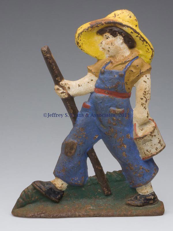 HUCKLEBERRY FINN CAST-IRON DOORSTOP: HUCKLEBERRY FINN CAST-IRON DOORSTOP, wedge half figure, original paint. Littco Products. First half 20th century. 12 3/8" H, 9 3/8" W. Provenance: From a New York estate.