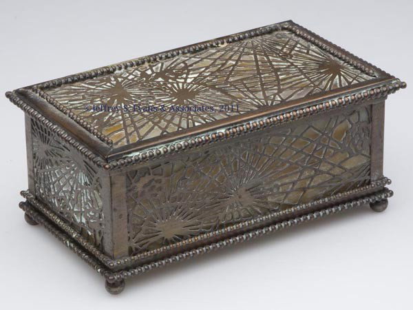 TIFFANY STUDIOS BRONZE PINE NEEDLE BOX: TIFFANY STUDIOS BRONZE PINE NEEDLE BOX, brown slag glass inserts, wood-lined interior, appropriate markings under base. First quarter 20th century. 3" H, 4" x 6 3/4". Provenance: From a New York estat