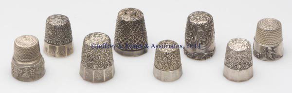 SIMONS BROTHERS STERLING SILVER THIMBLES, LOT OF E: SIMONS BROTHERS STERLING SILVER THIMBLES, LOT OF EIGHT, consisting of six embroidery examples including four Vermicelli Top and Facet with paneled bands, one Louis XV Rim, and one Scroll Chased Top; a