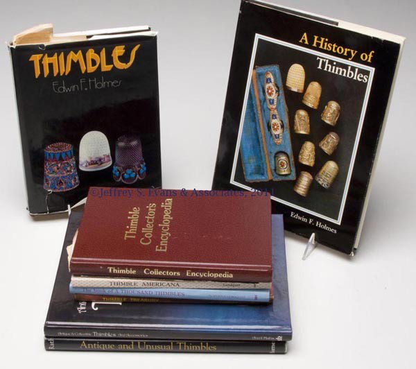 THIMBLES REFERENCE VOLUMES, LOT OF NINE: THIMBLES REFERENCE VOLUMES, LOT OF NINE, including "Thimble Collector's Encyclopedia", by John J. von Hoelle, Wilmington, DE: Dine-American Advertising, 1983, first edition, hard cover, signed by auth