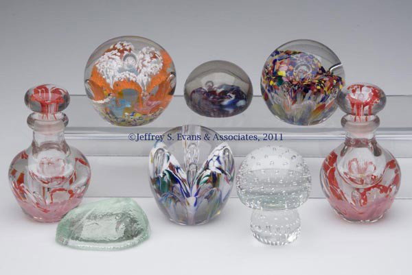 ASSORTED GLASS PAPERWEIGHTS AND RELATED ARTICLES, : ASSORTED GLASS PAPERWEIGHTS AND RELATED ARTICLES, LOT OF EIGHT, including a pair of cologne bottles, a pressed Plymouth Rock paperweight, and five various art glass paperweights. 20th century. 1 1/2" 