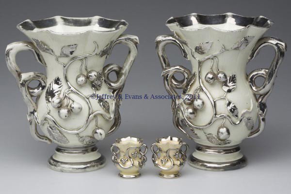 LANGEAIS FRENCH FAIENCE VASES, TWO PAIR: LANGEAIS FRENCH FAIENCE VASES, TWO PAIR, cream with worn silver luster decoration, comprising a pair with applied cherries and leaves, front and back, twig handles, scalloped rim, and impressed "CB" o