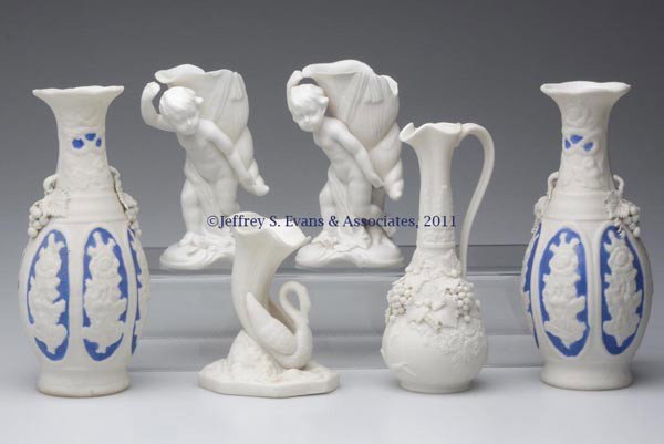 PARIAN CERAMIC ARTICLES, LOT OF SIX: PARIAN CERAMIC ARTICLES, LOT OF SIX, white, comprising a pair of vases with blue decoration and applied grapes and leaves, a pair of vases featuring a boy carrying a conch shell, a single vase with a 