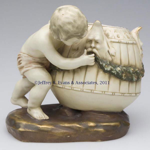 TURN-TEPLITZ AMPHORA PORCELAIN FIGURAL VASE: TURN-TEPLITZ AMPHORA PORCELAIN FIGURAL VASE, marked with a blue underglaze "A" under base. Late 19th/early 20th century. 7" H. Provenance: From a New York estate.