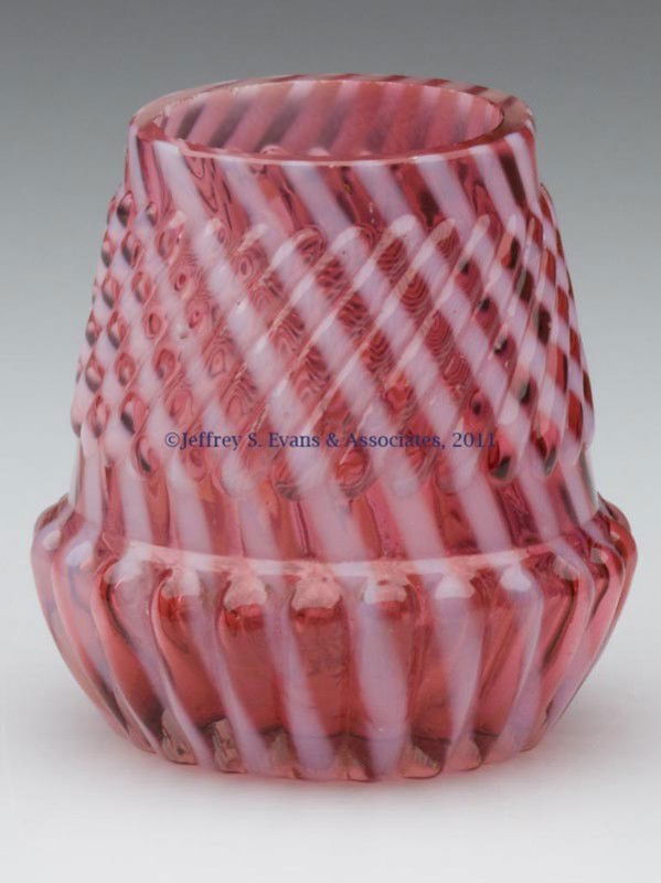 CHRYSANTHEMUM BASE SWIRL TOOTHPICK HOLDER: CHRYSANTHEMUM BASE SWIRL TOOTHPICK HOLDER, cranberry opalescent, factory-polished rim. Late 19th/early 20th century. 2 1/8" H. Provenance: From the collection of Edward N. Cooke.