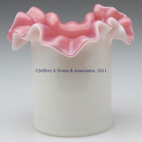 CASED GLASS TOOTHPICK HOLDER: CASED GLASS TOOTHPICK HOLDER, opal with pink interior, crimped and folded-out rim, polished pontil mark. Late 19th/early 20th century. 2 1/2" H. Provenance: From the collection of Edward N. Cooke.