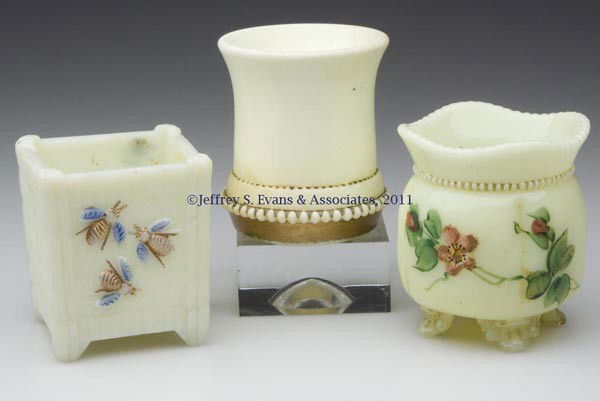 VARIOUS PATTERNS TOOTHPICK HOLDERS, LOT OF THREE: VARIOUS PATTERNS TOOTHPICK HOLDERS, LOT OF THREE, custard, two with gilt decoration and one with polychrome decoration, comprised of a Bees-In-A-Basket with blue decoration to wings, Georgia Gem, and