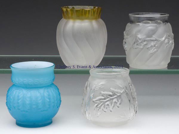 VARIOUS PATTERNS WITH FROSTED FINISH TOOTHPICK HOL: VARIOUS PATTERNS WITH FROSTED FINISH TOOTHPICK HOLDERS, LOT OF FOUR, comprised of a colorless Royal Ivy and a Royal Oak; a Francesware Swirl; and a cased blue Leaf Umbrella, factory polished rims. Fou