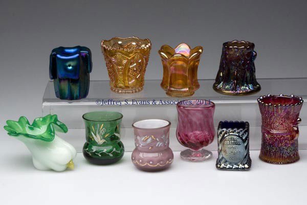 CONTEMPORARY COLORED GLASS TOOTHPICK HOLDERS, LOT: CONTEMPORARY COLORED GLASS TOOTHPICK HOLDERS, LOT OF TEN, various colors, comprised of six various iridescent examples, including a signed Robert Hansen stump, a vase form with pulled-down rim and fak