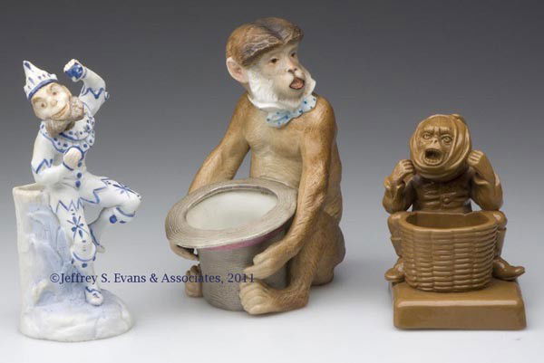 CERAMIC FIGURAL MONKEY TOOTHPICK HOLDERS, LOT OF T: CERAMIC FIGURAL MONKEY TOOTHPICK HOLDERS, LOT OF THREE, comprised of a brown painted example impressed on base "P & S", a naturalistic painted example with various imprinted numbers on base, and a dec