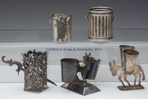 STERLING SILVER TOOTHPICK HOLDERS, LOT OF FIVE: STERLING SILVER TOOTHPICK HOLDERS, LOT OF FIVE, including two figural examples with double holders, a George W. Shiebler & Co with a figural dagger, a Frank W. Smith Silver Co. example, and an Industr