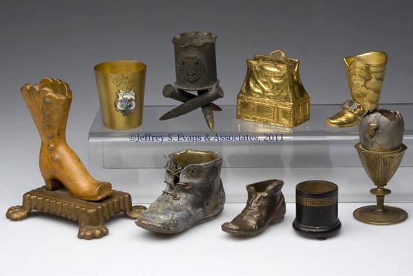VARIOUS METALS TOOTHPICK / MATCH HOLDERS, LOT OF N: VARIOUS METALS TOOTHPICK / MATCH HOLDERS, LOT OF NINE, seven figural examples comprised of four boots including a paint decorated cast iron and a brass/bronze example impressed "Peerage England" on so