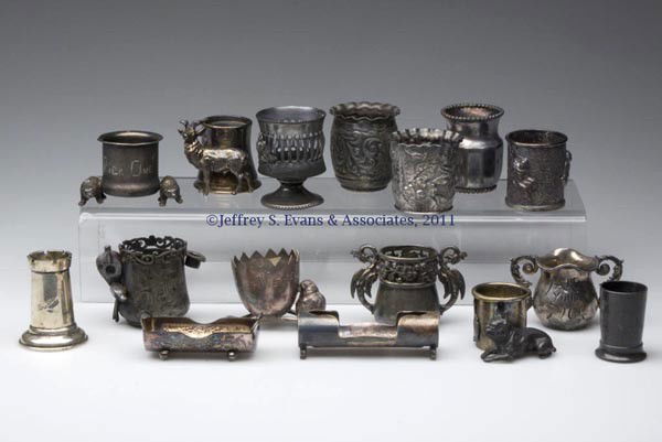 SILVER-PLATE TOOTHPICK HOLDERS, LOT OF 16: SILVER-PLATE TOOTHPICK HOLDERS, LOT OF 16, including a Washington DC souvenir with figural dog; a Kronheimer & Oldenbusch Co. with Philadelphia souvenir and figural stag; a Wm. A. Rogers Ltd. example