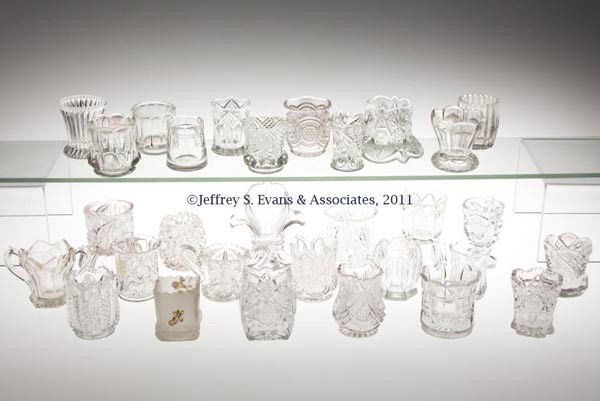 VARIOUS PATTERN GLASS TOOTHPICK HOLDERS, LOT OF 30: VARIOUS PATTERN GLASS TOOTHPICK HOLDERS, LOT OF 30, colorless, including Atlanta with frosted finish and floral polychrome decoration, New Jersey, Fostoria's No. 1630/Alexis, Massachusetts, and 26 oth