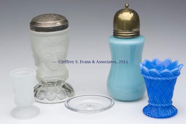 PRESSED GLASS CONDIMENT ARTICLES, LOT OF FIVE: PRESSED GLASS CONDIMENT ARTICLES, LOT OF FIVE, comprising a repreoduction Three Face sugar shaker and toothpick holder, a turquoise cased-glass muffineer, a fiery opalescent blue Basketweave toothpick