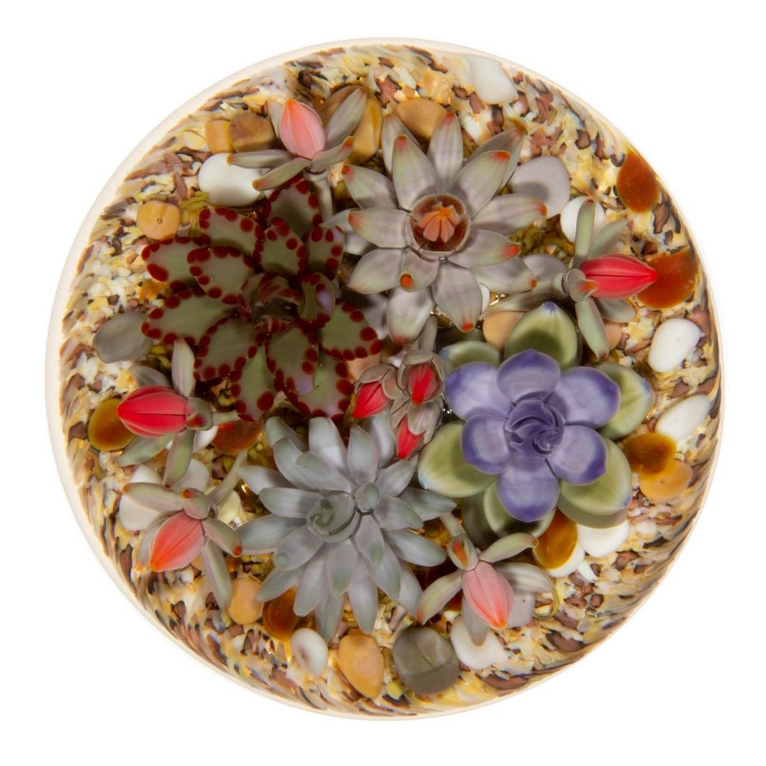 GORDON SMITH (AMERICAN, B. 1959) SUCCULENTS LAMPWORK STUDIO ART GLASS PAPERWEIGHT: GORDON SMITH (AMERICAN, B. 1959) SUCCULENTS LAMPWORK STUDIO ART GLASS PAPERWEIGHT, having four central succulents being either green, red, purple, and/or pale blue, nine orange/red buds, encircled wit