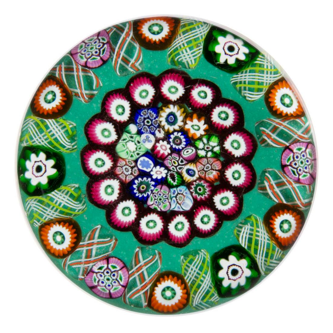 MONART / PAUL YSART (SCOTTISH, 1904-1979) MEDALLION MILLEFIORI ART GLASS PAPERWEIGHT: MONART / PAUL YSART (SCOTTISH, 1904-1979) MEDALLION MILLEFIORI ART GLASS PAPERWEIGHT, central multi-colored millefiori medallion featuring a variety of multi-colored canes including cogs and complex e