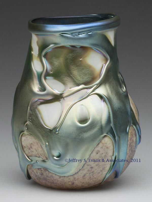 LOTTON LAVA STUDIO ART GLASS VASE: LOTTON LAVA STUDIO ART GLASS VASE, iridized lava-flow design on translucent white and mottled brown ground, polished base and pontil mark, signed and undated. Charles Lotton. Second half 20th century.