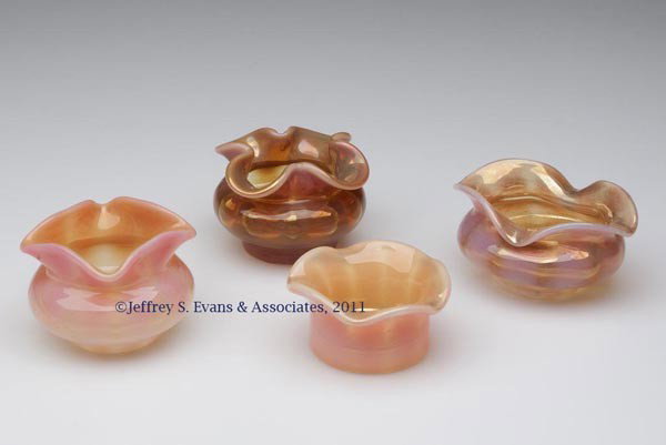 MONOT AND STUMPF, PANTIN, RIB OPTIC GLASS OPEN IND: MONOT AND STUMPF, PANTIN, RIB OPTIC GLASS OPEN INDIVIDUAL SALTS, LOT OF FOUR, light and dark apricot striped opalescent, comprising three round and one oval, each with polished pontil mark. Fourth qua