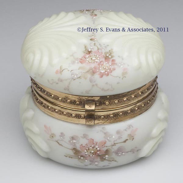 WAVECREST DOUBLE SHELL DRESSER BOX: WAVECREST DOUBLE SHELL DRESSER BOX, cream color ground with polychrome floral decoration, brass fittings, original fabric interior, pennant trademark on base. The C. F. Monroe Co. Fourth quarter 19th 