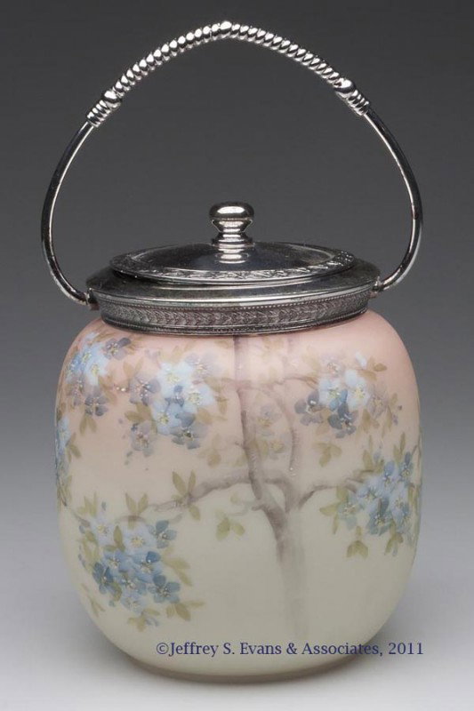 MT. WASHINGTON CROWN MILANO CRACKER JAR: MT. WASHINGTON CROWN MILANO CRACKER JAR, fired-on Burmese ground with hand-painted polychrome floral decoration, unmarked, with silver-plate fittings, cover marked for Pairpoint Manufacturing Co. Mt. 