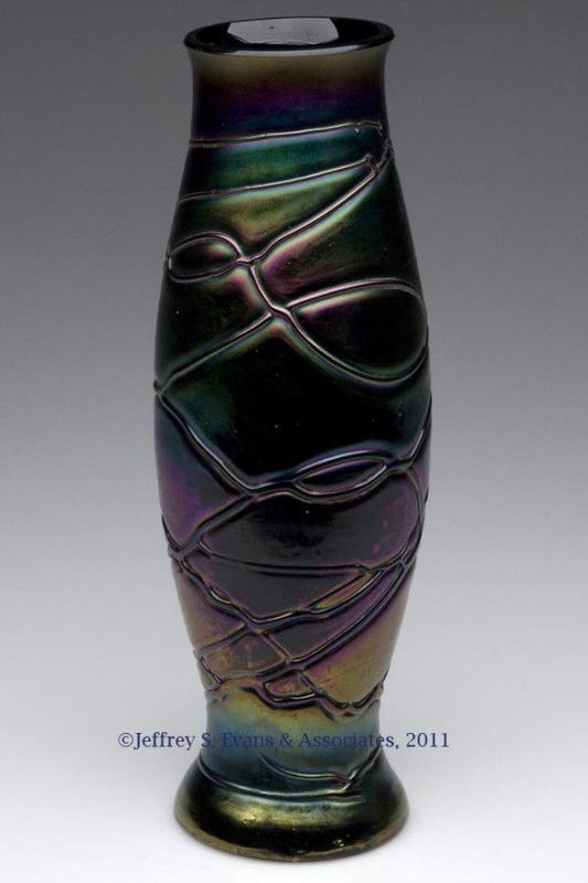 PALLME-KONIG RANDOM THREADED GLASS VASE: PALLME-KONIG RANDOM THREADED GLASS VASE, iridescent deep amethyst body and decoration, factory polished rim. First quarter 20th century. 9 1/2" H. Provenance: Property of a Maryland collector.