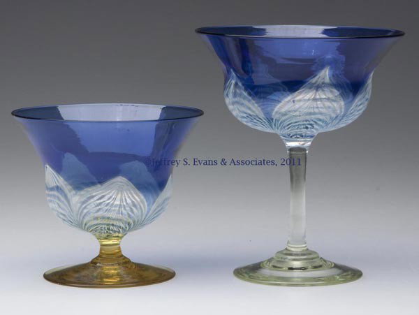 DURAND PEACOCK FEATHER CHAMPAGNE AND SHERBET: DURAND PEACOCK FEATHER CHAMPAGNE AND SHERBET, blue and colorless bowls with opal and blue decoration, champagne raised on a crystal/pale yellow stem and foot, sherbet raised on a Spanish yellow stem a