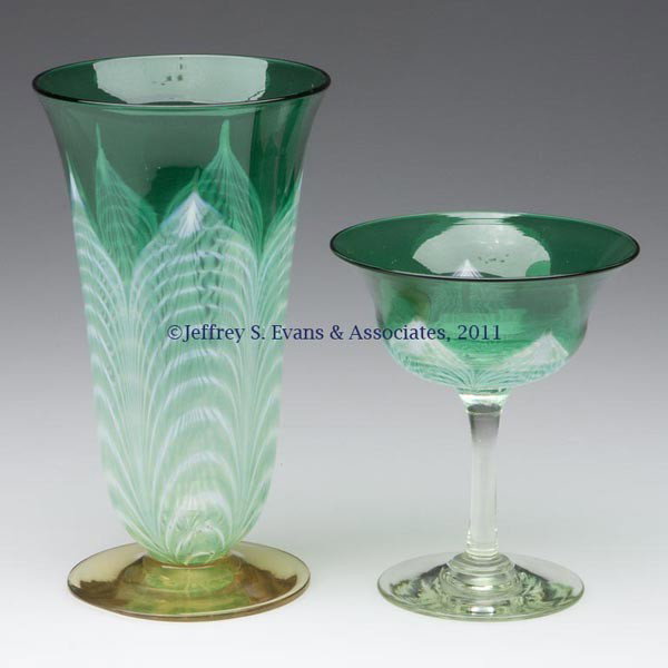 DURAND PEACOCK FEATHER CHAMPAGNE AND FOOTED TUMBLE: DURAND PEACOCK FEATHER CHAMPAGNE AND FOOTED TUMBLER / ICE TEA, green and colorless bowls with opal and green decoration, champagne raised on a crystal/pale yellow stem and foot, tumbler raised on a Sp