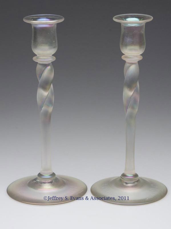 STEUBEN TWISTED SHAFT PAIR OF CANDLESTICKS: STEUBEN TWISTED SHAFT PAIR OF CANDLESTICKS, Verre de Soie, shape like 379, each socket with faint ribs, rough pontil marks, post-production "F Carder" and "Steuben" signatures. Steuben Glass Works. Fi