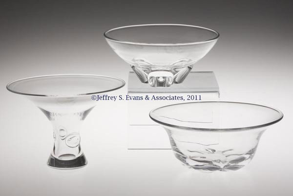 STEUBEN CRYSTAL ARTICLES, LOT OF TWO: STEUBEN CRYSTAL ARTICLES, LOT OF TWO, comprising a bowl and vase, each with applied decoration and signed "Steuben". Together with a signed "Orrefors" bowl. Three pieces total. Mid 20th century. 3 1/4