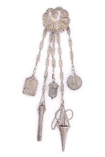 VICTORIAN ENGLISH STERLING SILVER SEWING CHATELAINE WITH APPENDAGES: VICTORIAN ENGLISH STERLING SILVER SEWING CHATELAINE WITH APPENDAGES, having ornate chased floral decoration, chatelaine hook with five chain attachments featuring appendages of a pincushion, a