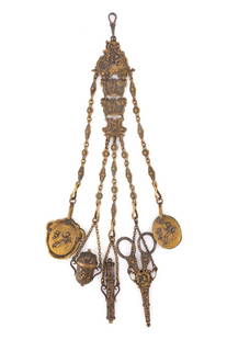 VICTORIAN GILT BRASS SEWING CHATELAINE WITH APPENDAGES: VICTORIAN GILT BRASS SEWING CHATELAINE WITH APPENDAGES, medallion-form upper plate with clasp for attachment, graduated plates with goddess and cherub ornamentation, supports five chains with floral