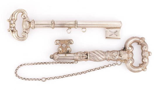 CONTINENTAL SILVER FIGURAL KEY SEWING CHATELAINE NEEDLE CASE APPENDAGES, LOT OF TWO: CONTINENTAL SILVER FIGURAL KEY SEWING CHATELAINE NEEDLE CASE APPENDAGES, LOT OF TWO, each of two-part construction, comprising a detailed example with scrolls and spirals, supported with original