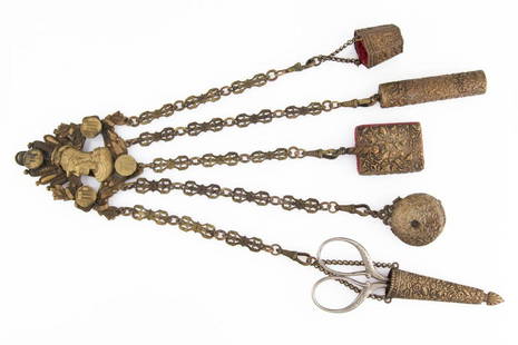 BRASS FIGURAL SEWING CHATELAINE WITH APPENDAGES: BRASS FIGURAL SEWING CHATELAINE WITH APPENDAGES, tri-form top with central bust depicting Athena with helmet topped by a winged serpent, surrounded by four medallions with a stand, crab, and "O4O",