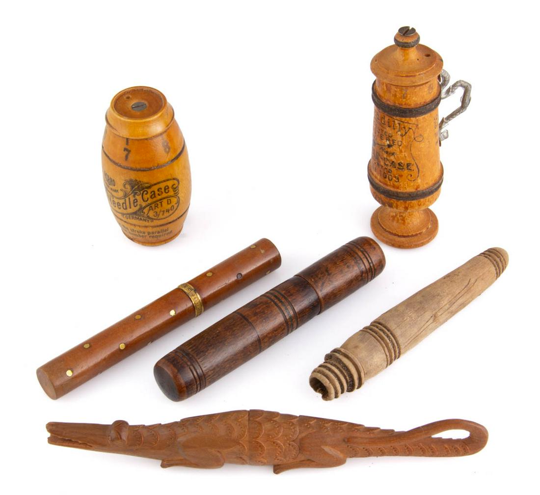ASSORTED WOODEN SEWING NEEDLE CASES, LOT OF SIX: ASSORTED WOODEN SEWING NEEDLE CASES, LOT OF SIX, comprising two figural mauchline ware examples consisting a barrel-form marked "Needle Case Trade Mark / Accept My Best Wishes / Patented No. 2001", an