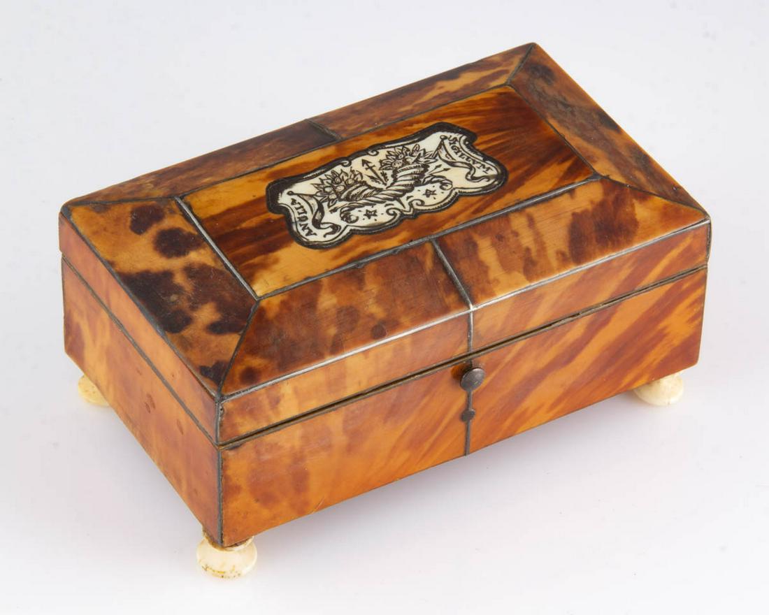 ENGLISH TORTOISE SHELL AND INLAID SEWING BOX: ENGLISH TORTOISE SHELL AND INLAID SEWING BOX, rectangular form supported by four turned bone feet with a paper covering to base, metal inlay to corners, edges and medial areas, hinged cover with origi