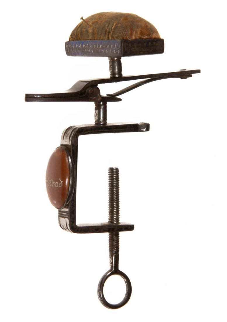 DECORATED POLISHED STEEL FIGURAL SEWING CLAMP WITH PINCUSHION (1 of 2)