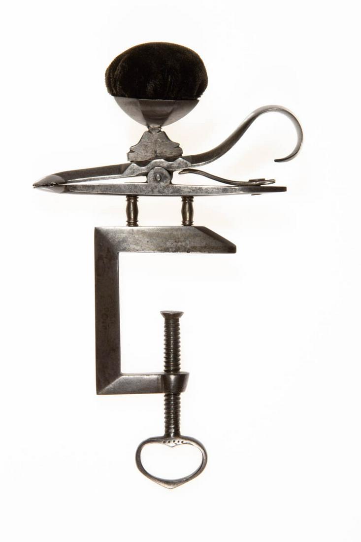 CONTINENTAL POLISHED STEEL / IRON FIGURAL SEWING CLAMP WITH PINCUSHION (1 of 2)