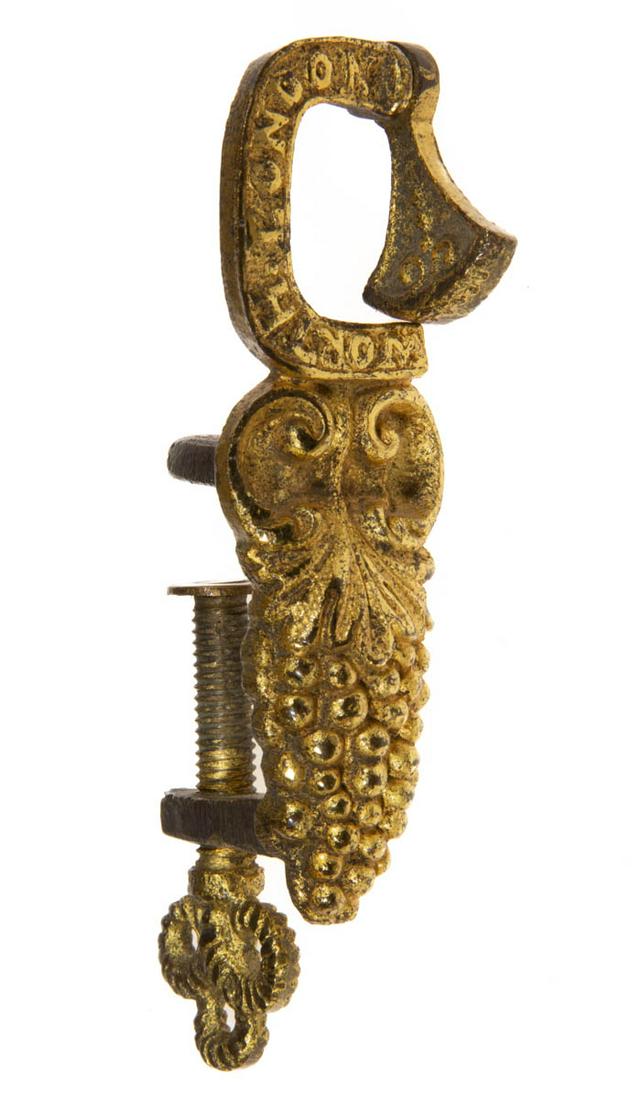 ENGLISH WORTH GILDED CAST-BRASS SEWING QUILTER'S CLAMP: ENGLISH WORTH GILDED CAST-BRASS SEWING QUILTER'S CLAMP, stylized scrolls over an elongated cluster of grapes, upper C-form table clamp embossed "WORTH LONDON" and with fabric holding rocker-cam mechan