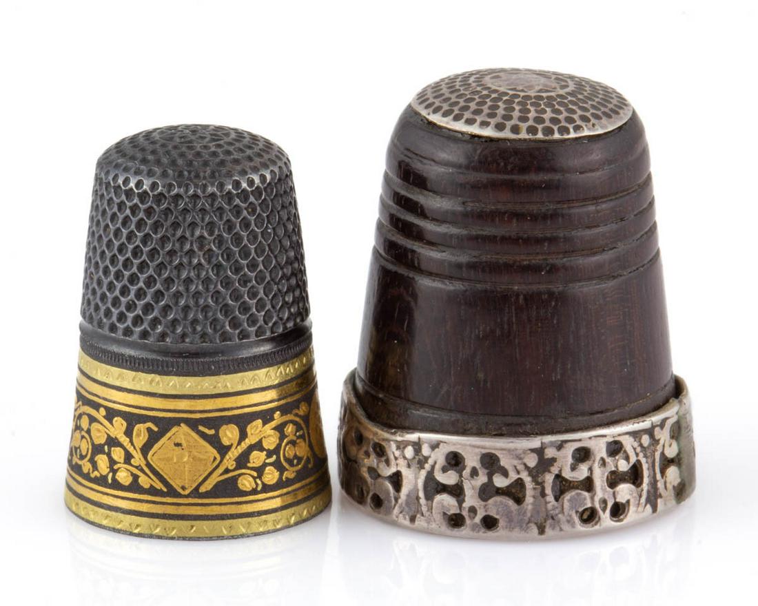 GERMAN GABLER DAMASCENE SEWING THIMBLE: GERMAN GABLER DAMASCENE SEWING THIMBLE, steel with gold damascene inlay around band featuring floral motifs. Eight-point star mark to top. Together with a Gabler silver and bog oak thimble. Two pieces